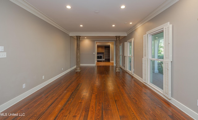 unfurnished room with hardwood / wood-style flooring, recessed lighting, baseboards, ornamental molding, and decorative columns