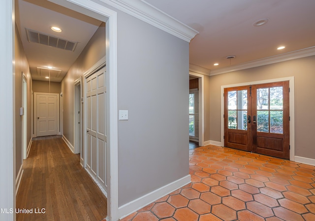 entrance foyer with recessed lighting, baseboards, visible vents, and ornamental molding