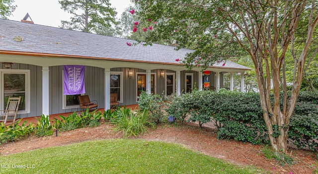 view of front of house featuring board and batten siding and covered porch