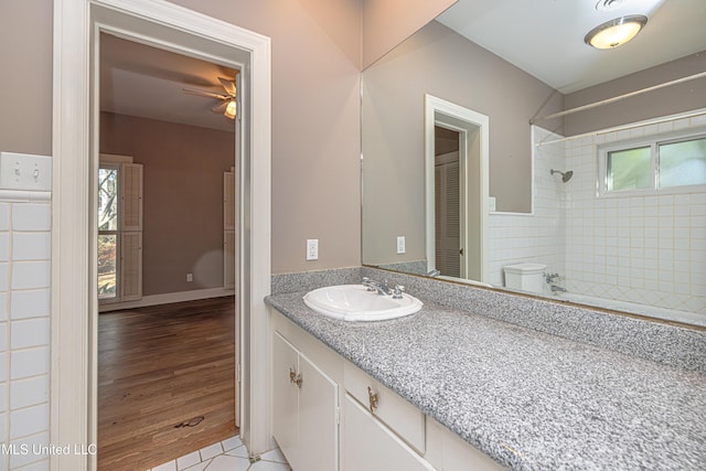 full bath featuring a shower, tile patterned flooring, and vanity