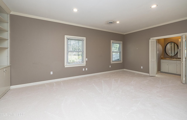 unfurnished bedroom featuring recessed lighting, light colored carpet, visible vents, baseboards, and crown molding