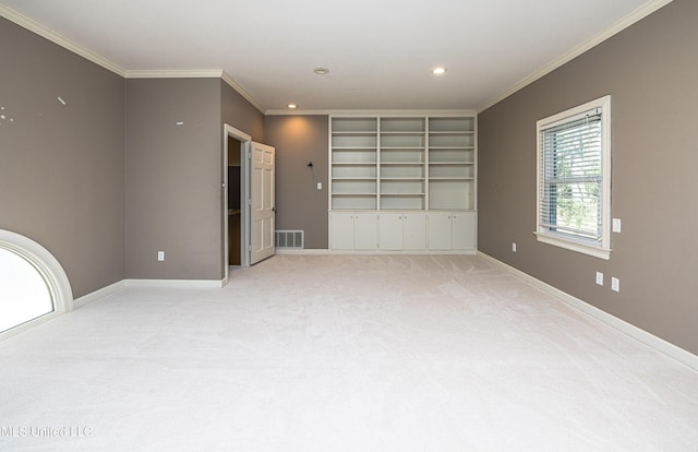 empty room with carpet floors, recessed lighting, visible vents, ornamental molding, and baseboards