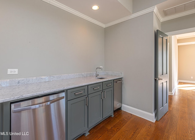 kitchen with visible vents, gray cabinetry, stainless steel dishwasher, ornamental molding, and a sink