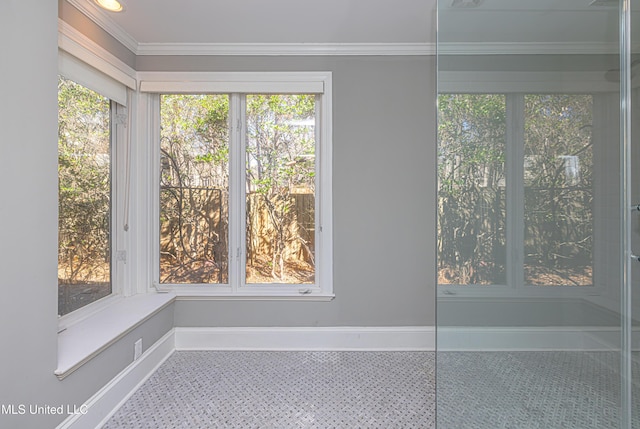 interior details with baseboards and crown molding