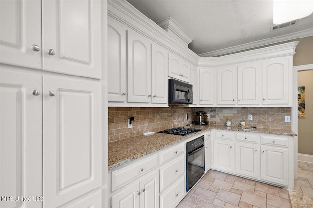 108 Merlot Cv, Clinton, MS 39056 - kitchen with black appliances, decorative backsplash, white cabinets, and ornamental molding