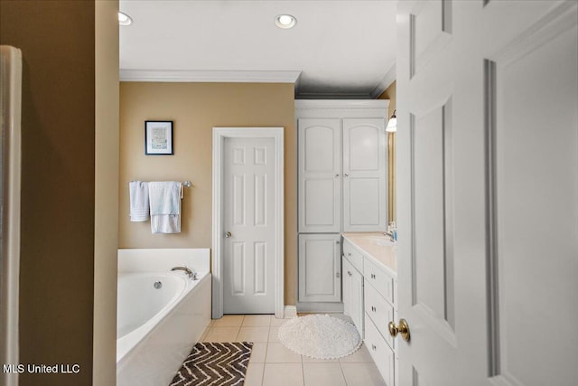 108 Merlot Cv, Clinton, MS 39056 - bathroom with crown molding, tile patterned floors, a garden tub, vanity, and recessed lighting