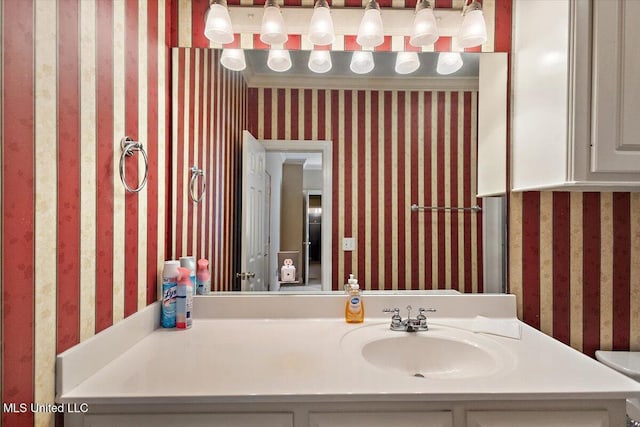 108 Merlot Cv, Clinton, MS 39056 - bathroom featuring wallpapered walls and vanity