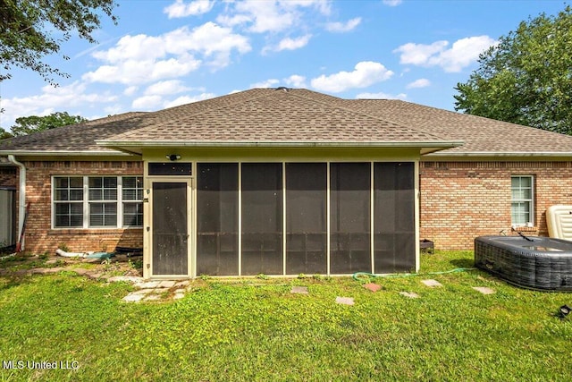 108 Merlot Cv, Clinton, MS 39056 - rear view of property with brick siding, roof with shingles, cooling unit, and a lawn