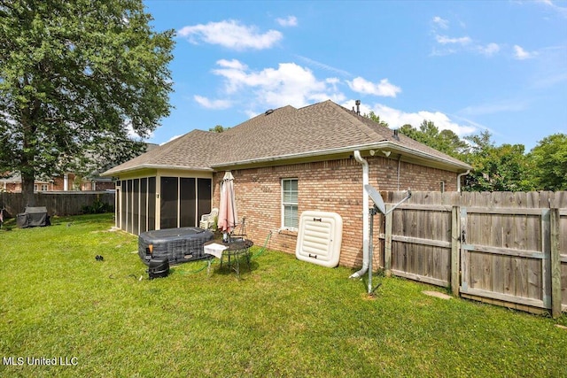 108 Merlot Cv, Clinton, MS 39056 - rear view of property featuring a sunroom, brick siding, a shingled roof, and a gate