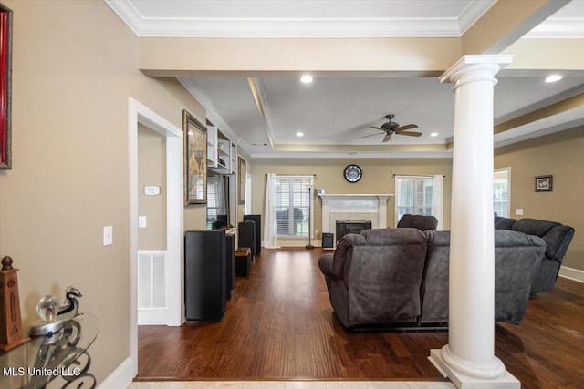 108 Merlot Cv, Clinton, MS 39056 - living room featuring decorative columns, a ceiling fan, crown molding, wood finished floors, and a high end fireplace