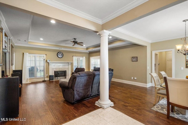 108 Merlot Cv, Clinton, MS 39056 - living area with ornate columns, a ceiling fan, a high end fireplace, baseboards, and wood finished floors