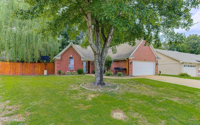 9821 Morgan Manor Dr, Olive Branch, MS 38654 - view of front of property featuring brick siding, an attached garage, and driveway