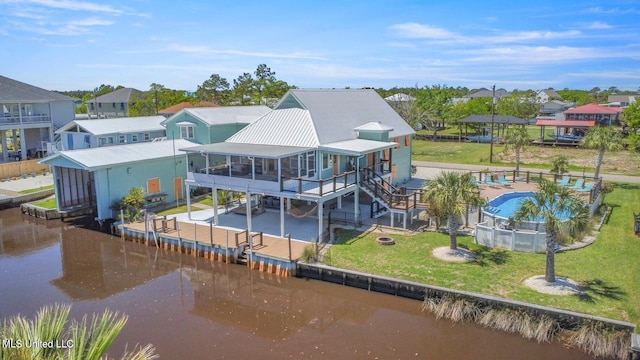 rear view of property with a patio and a yard