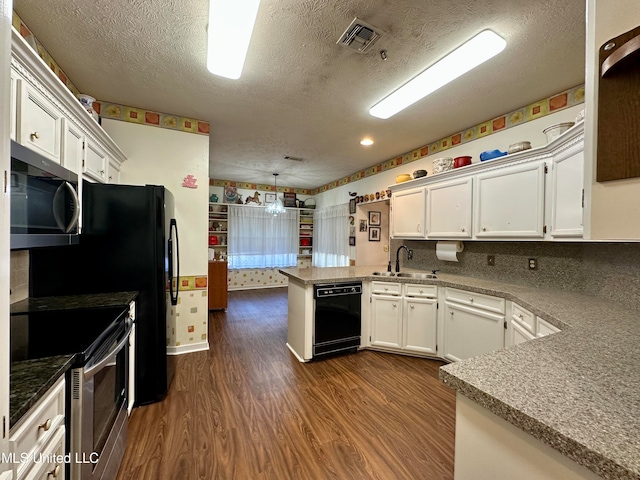 kitchen featuring stainless steel appliances, dark hardwood / wood-style flooring, kitchen peninsula, and white cabinets