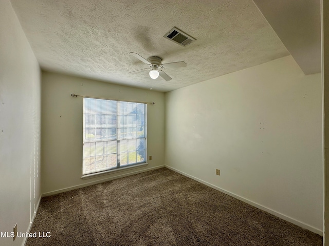 unfurnished room featuring ceiling fan, carpet flooring, and a textured ceiling