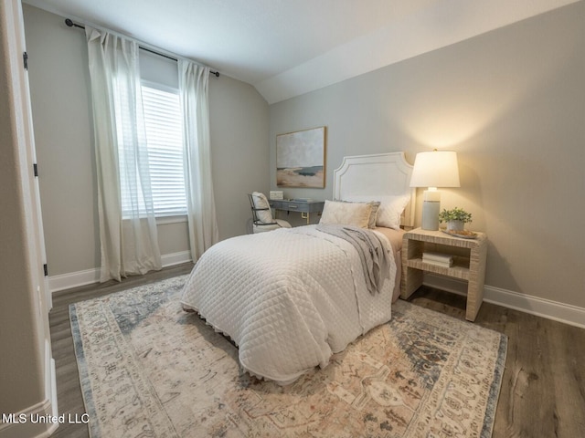 9626 W Oaklawn Rd, Biloxi, MS 39532 - bedroom with wood finished floors and vaulted ceiling