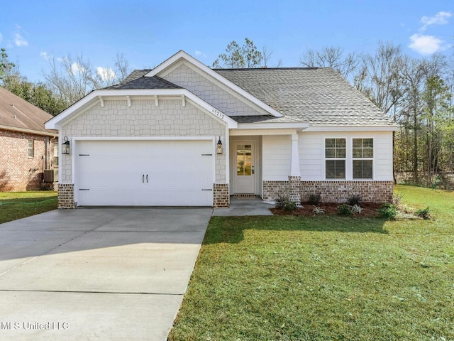 9626 W Oaklawn Rd, Biloxi, MS 39532 - craftsman-style home featuring brick siding, a garage, a front yard, and concrete driveway