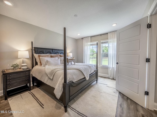 9626 W Oaklawn Rd, Biloxi, MS 39532 - bedroom featuring wood finished floors and recessed lighting