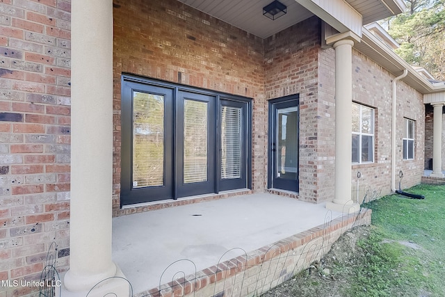 property entrance featuring a patio