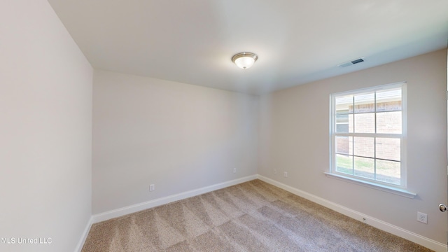 7876 Gardendale Dr, Olive Branch, MS 38654 - spare room featuring baseboards and light carpet