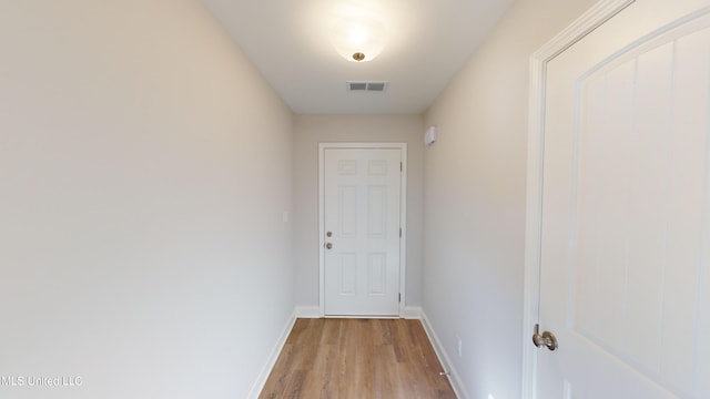 7876 Gardendale Dr, Olive Branch, MS 38654 - doorway to outside featuring light wood finished floors and baseboards