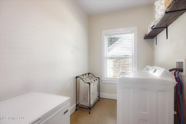 335 Aaron Rd, Sarah, MS 38665 - laundry room with washer and dryer and baseboards