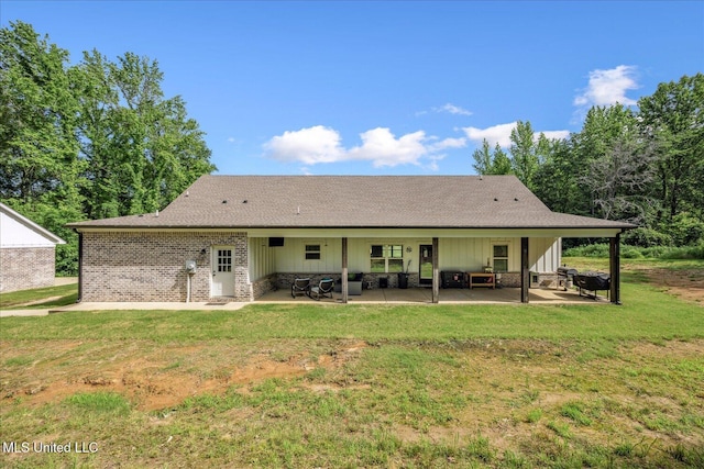 335 Aaron Rd, Sarah, MS 38665 - back of property with a patio area, a lawn, and roof with shingles
