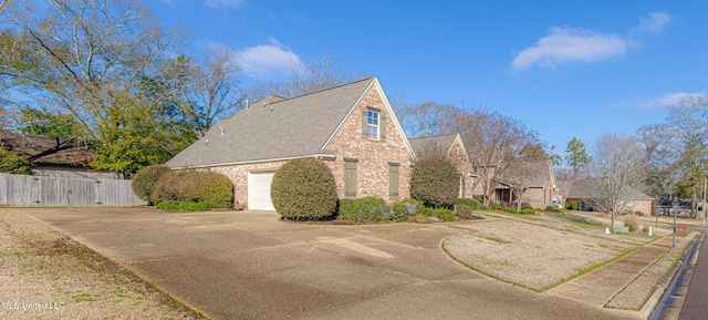 view of side of property featuring a garage