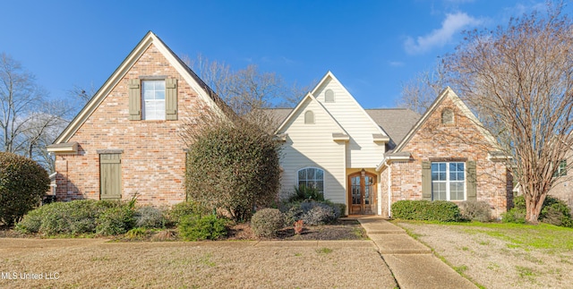 view of front facade with french doors and a front yard