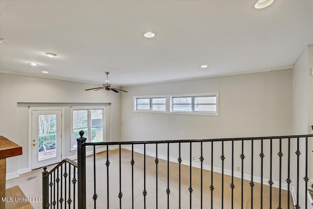 empty room featuring recessed lighting, crown molding, and baseboards