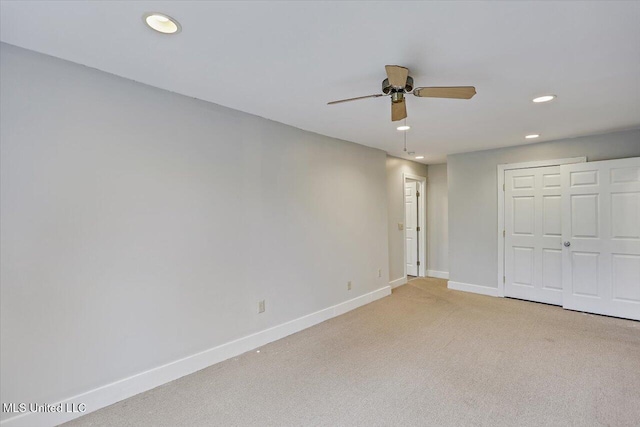 unfurnished bedroom with recessed lighting, a closet, a ceiling fan, light carpet, and baseboards