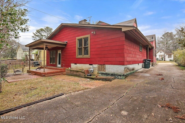 exterior space featuring a patio area and fence