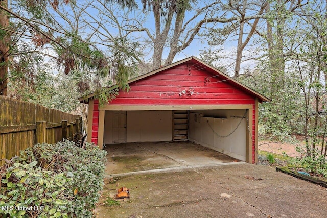 garage with fence