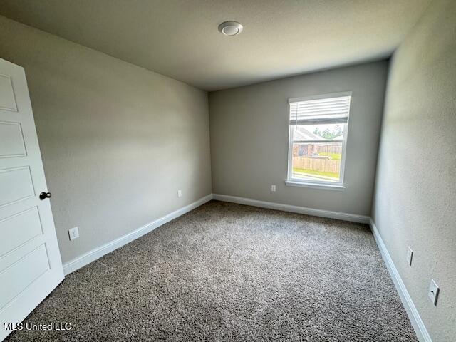 5378 Leeds Ln, Biloxi, MS 39532 - carpeted empty room with baseboards
