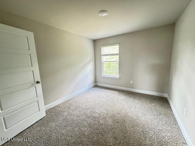 5378 Leeds Ln, Biloxi, MS 39532 - empty room with carpet floors and baseboards