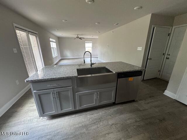 5378 Leeds Ln, Biloxi, MS 39532 - kitchen with stainless steel dishwasher, gray cabinetry, a sink, baseboards, and recessed lighting