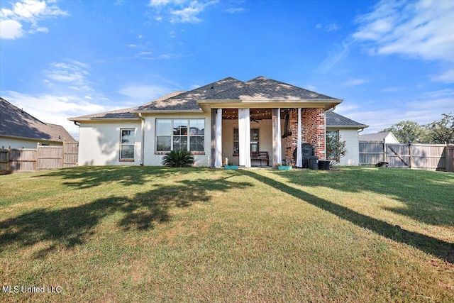 105 Twain Trl, Clinton, MS 39056 - rear view of property with a lawn, brick siding, and a fenced backyard