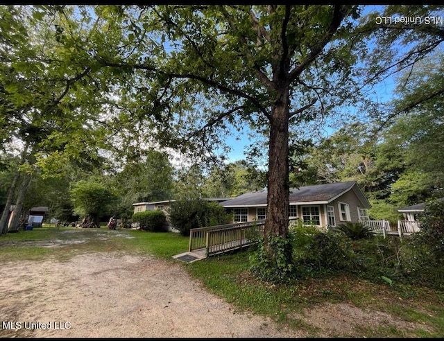 view of front of home featuring a wooden deck