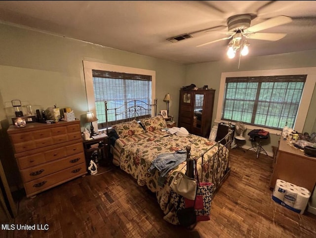 20454 Saucier Advance Rd, Saucier, MS 39574 - bedroom featuring visible vents, a ceiling fan, and dark wood-type flooring
