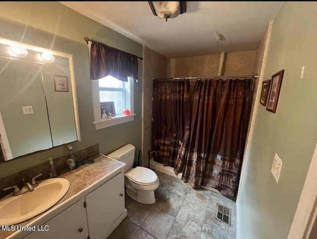 20454 Saucier Advance Rd, Saucier, MS 39574 - full bathroom featuring visible vents, vanity, toilet, a shower with curtain, and stone finish flooring