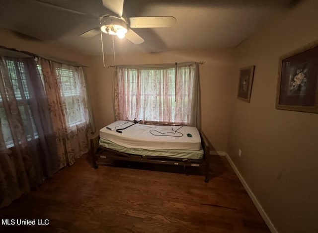 20454 Saucier Advance Rd, Saucier, MS 39574 - bedroom featuring baseboards, ceiling fan, and wood finished floors