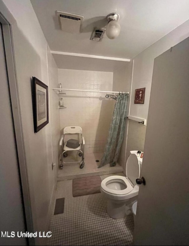 20454 Saucier Advance Rd, Saucier, MS 39574 - bathroom with visible vents, tile patterned floors, toilet, and a shower stall