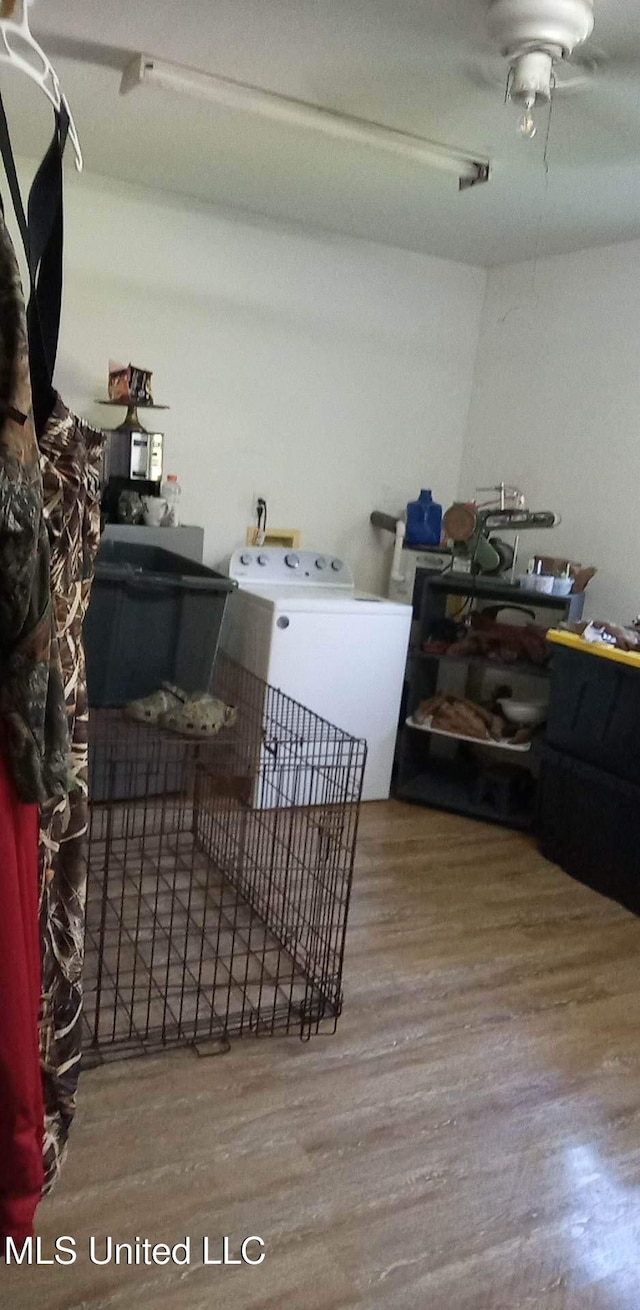 20454 Saucier Advance Rd, Saucier, MS 39574 - clothes washing area with washer / clothes dryer and wood finished floors