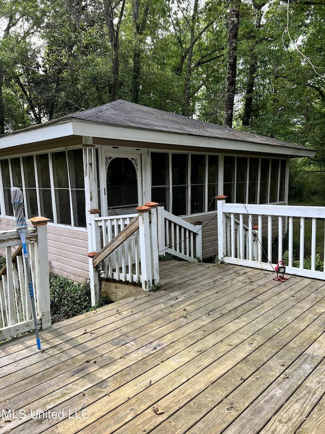 20454 Saucier Advance Rd, Saucier, MS 39574 - wooden deck featuring a sunroom