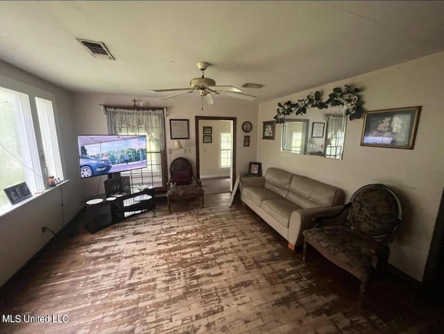 20454 Saucier Advance Rd, Saucier, MS 39574 - living room with a ceiling fan, visible vents, and wood finished floors