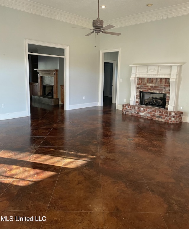 unfurnished living room featuring ceiling fan, a fireplace, and ornamental molding