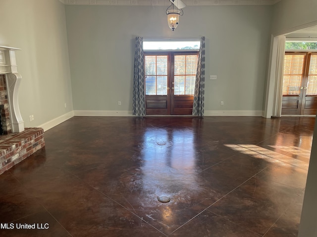 interior space featuring french doors and a brick fireplace