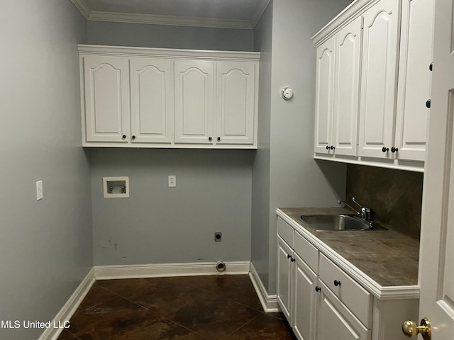 washroom with cabinets, hookup for a washing machine, hookup for an electric dryer, crown molding, and sink