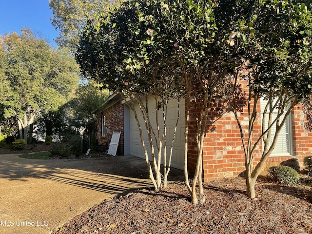 view of side of property featuring a garage