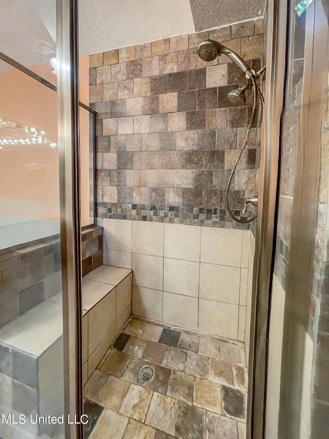 bathroom featuring a tile shower